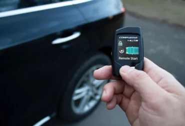 Compustar Q9 Remote Start Confirmation Compustar Q9 two-way remote confirming remote start beside a car